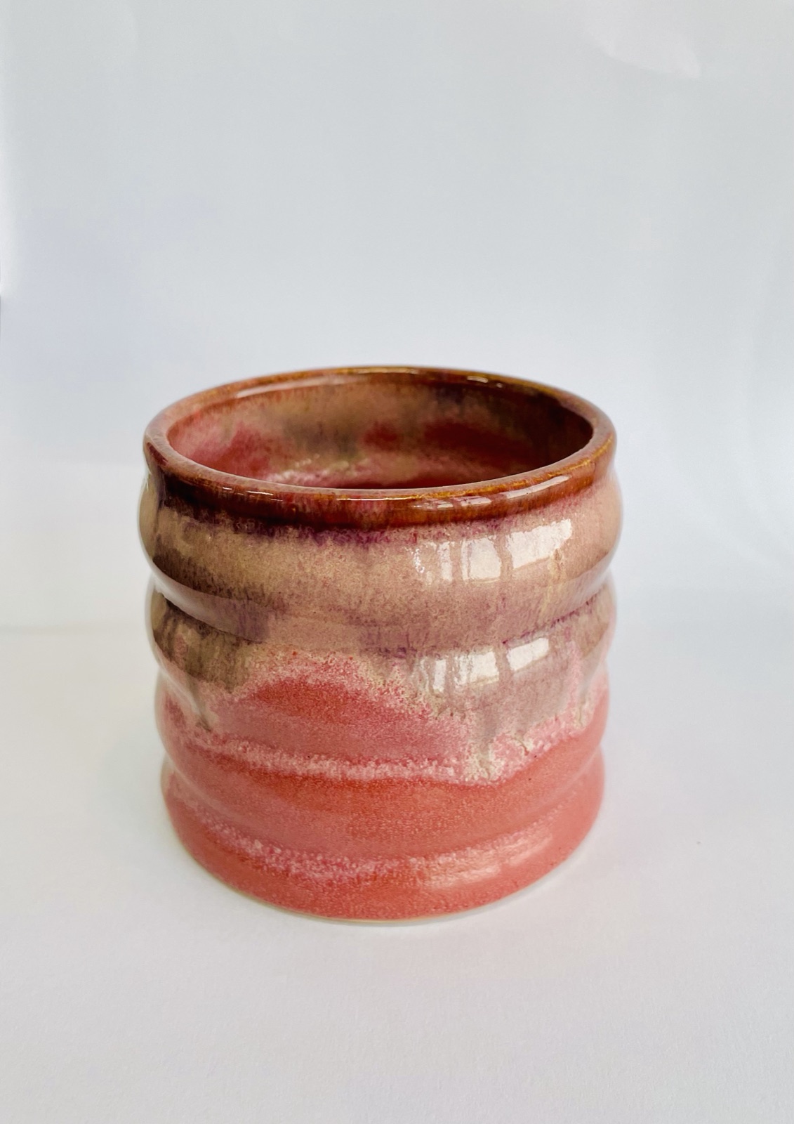 Wheel-thrown ceramic vessel with rose and copper glaze